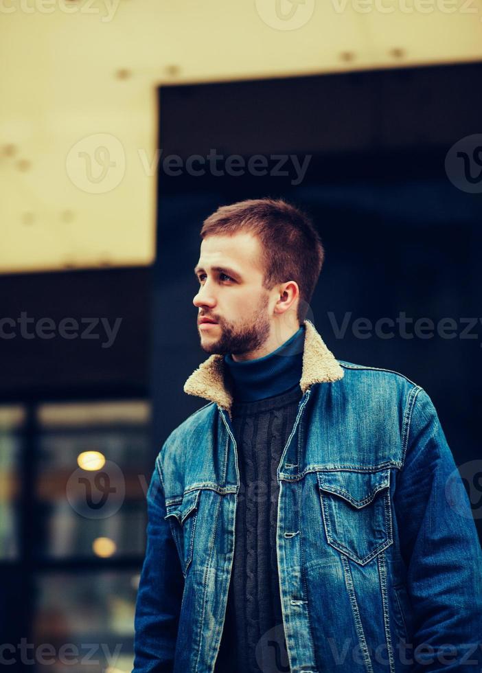 man in a denim jacket photo