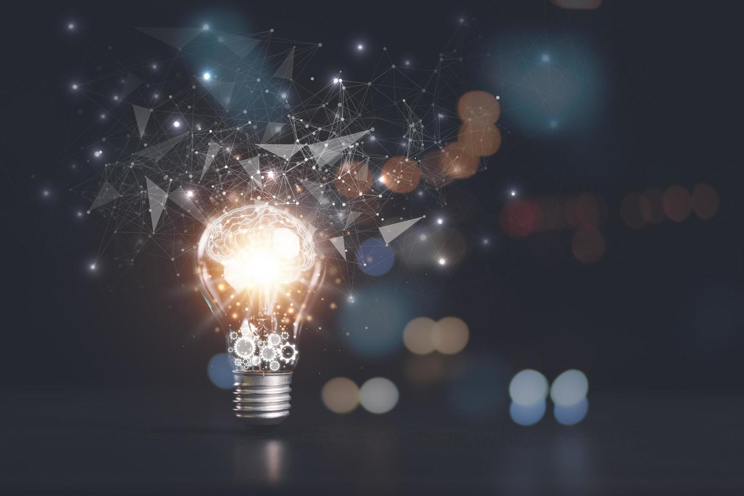 the light bulb is on the table,for Concept new idea, concept with innovation and inspiration, innovative technology in science concept and modern business development,creative idea. photo