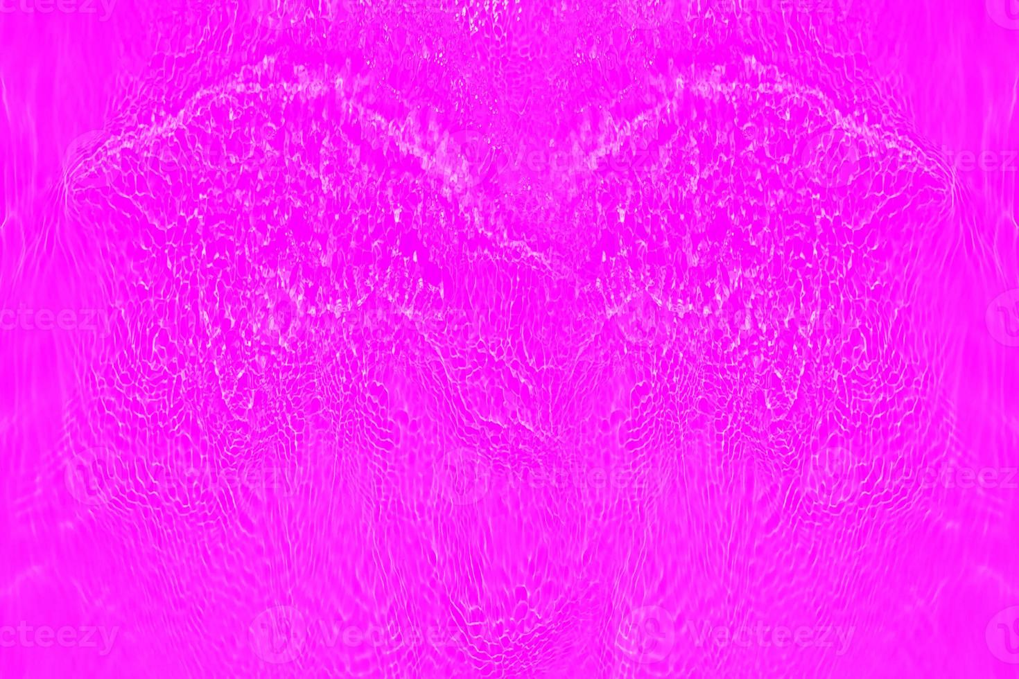 Defocus blurred transparent purple colored clear calm water surface texture with splashes and bubbles. Trendy abstract nature background. Water waves in sunlight with copy space. Pink watercolor shine photo
