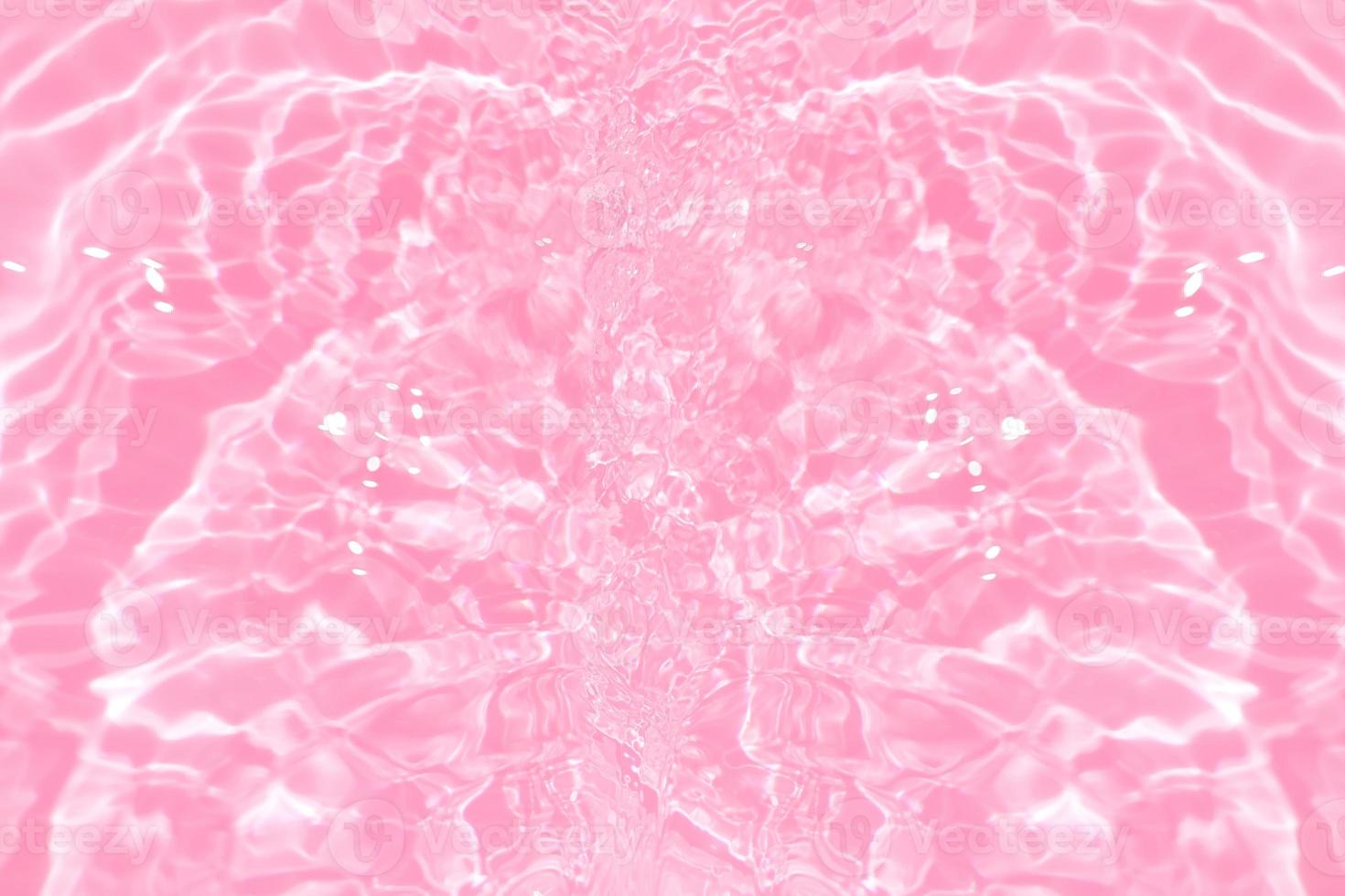 Defocus blurred transparent pink colored clear calm water surface texture with splashes and bubbles. Trendy abstract nature background. Water waves in sunlight with copy space. Pink watercolor shining photo