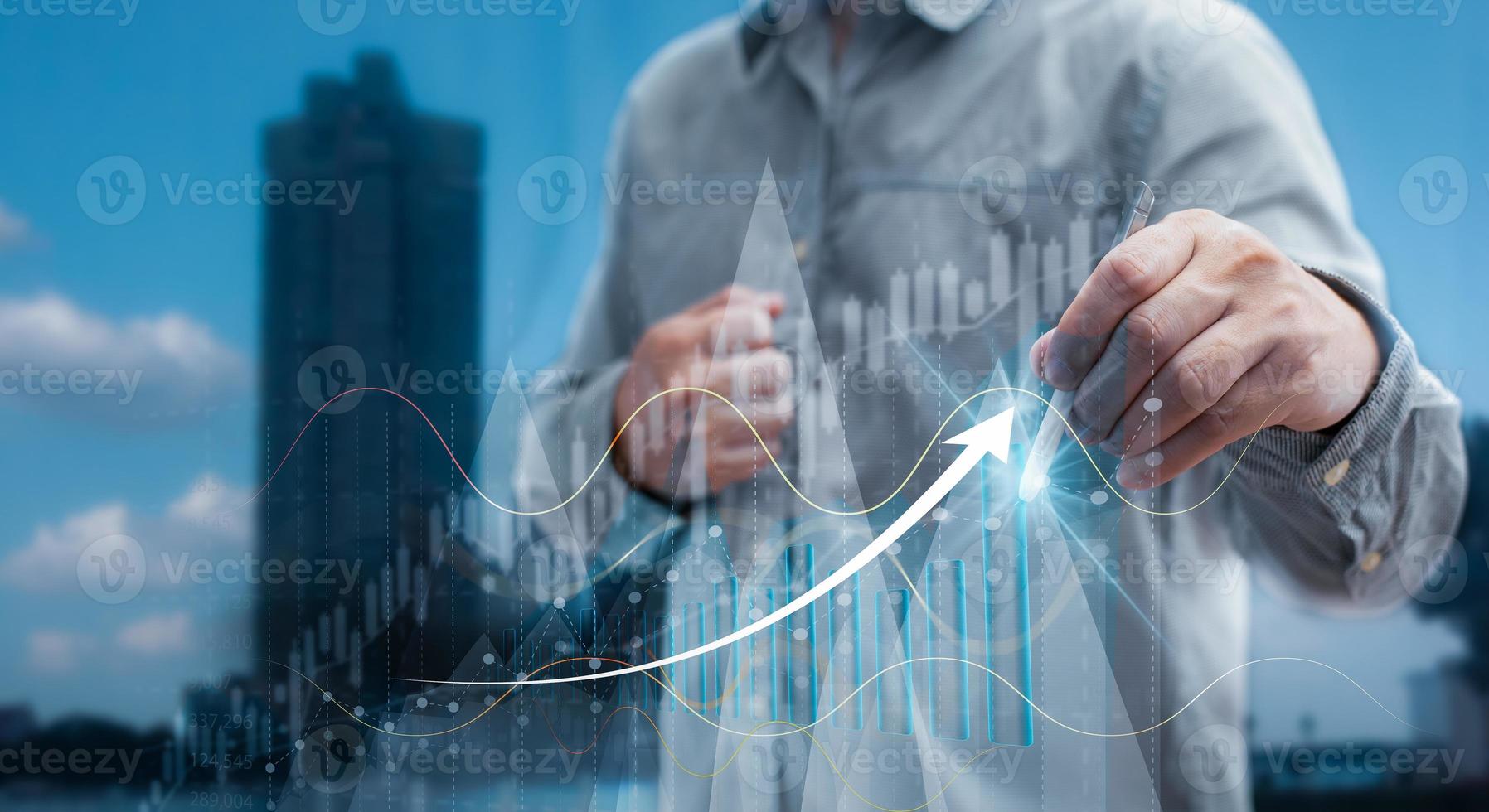 Businessmen draw growth graphs and progress of business and analyze financial, and investment.Use technology to plan strategy to success goals and growth.online business, e-commerce, online marketing. photo