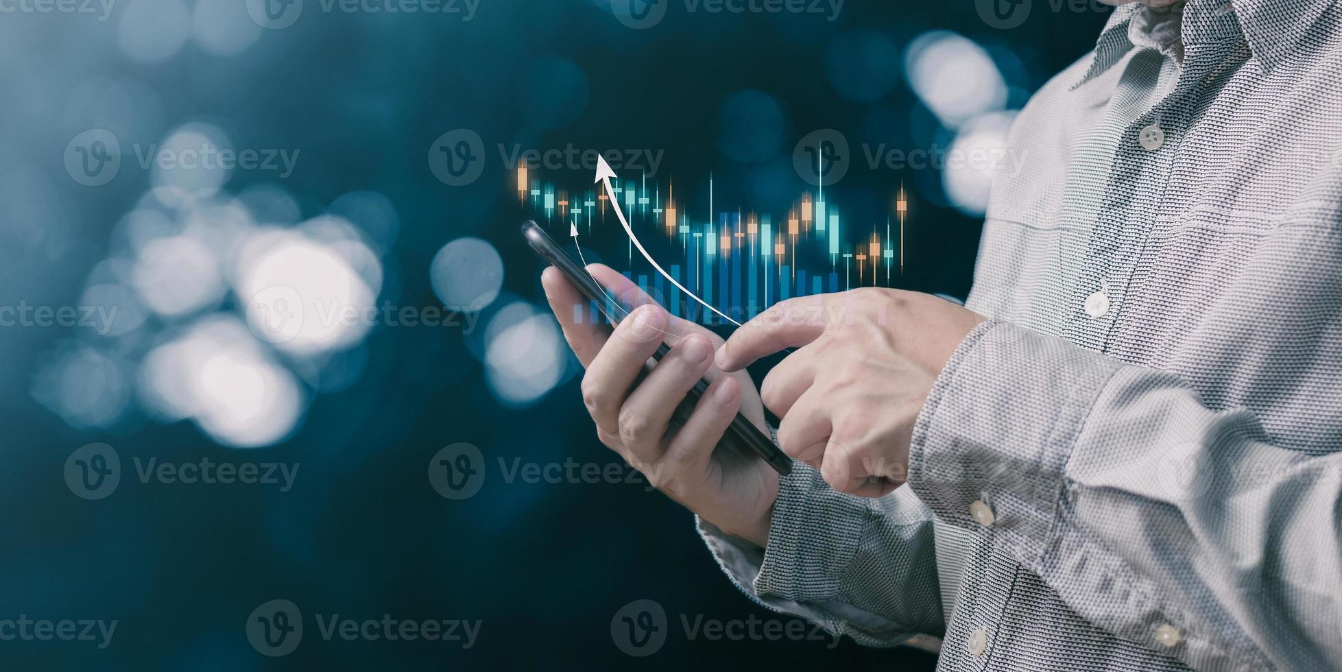 Businessmen draw growth graphs and progress of business and analyze financial, and investment.Use technology to plan strategy to success goals and growth.online business, e-commerce, online marketing. photo