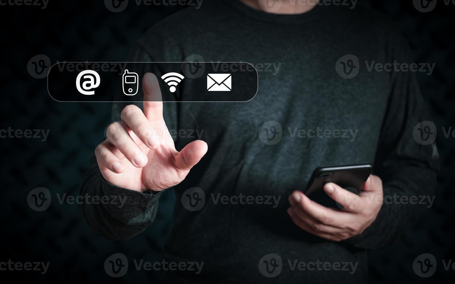 Businessman using smartphone and touch on virtual screen contact icons ,address,phone,wifi,email,Contact us and Customer support hotline people connect. photo