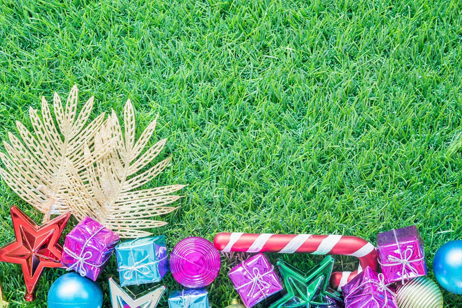 Christmas decoration on green grass with copy space photo