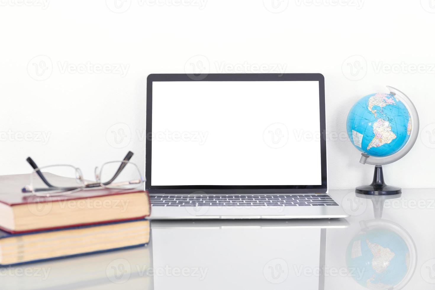 Laptop mockup with blank screen on table photo