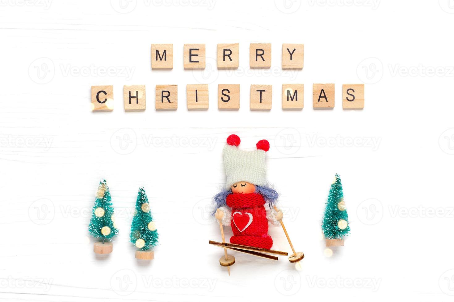 Flat lay composition Girl skiing Merry Christmas and Happy New Year concept photo