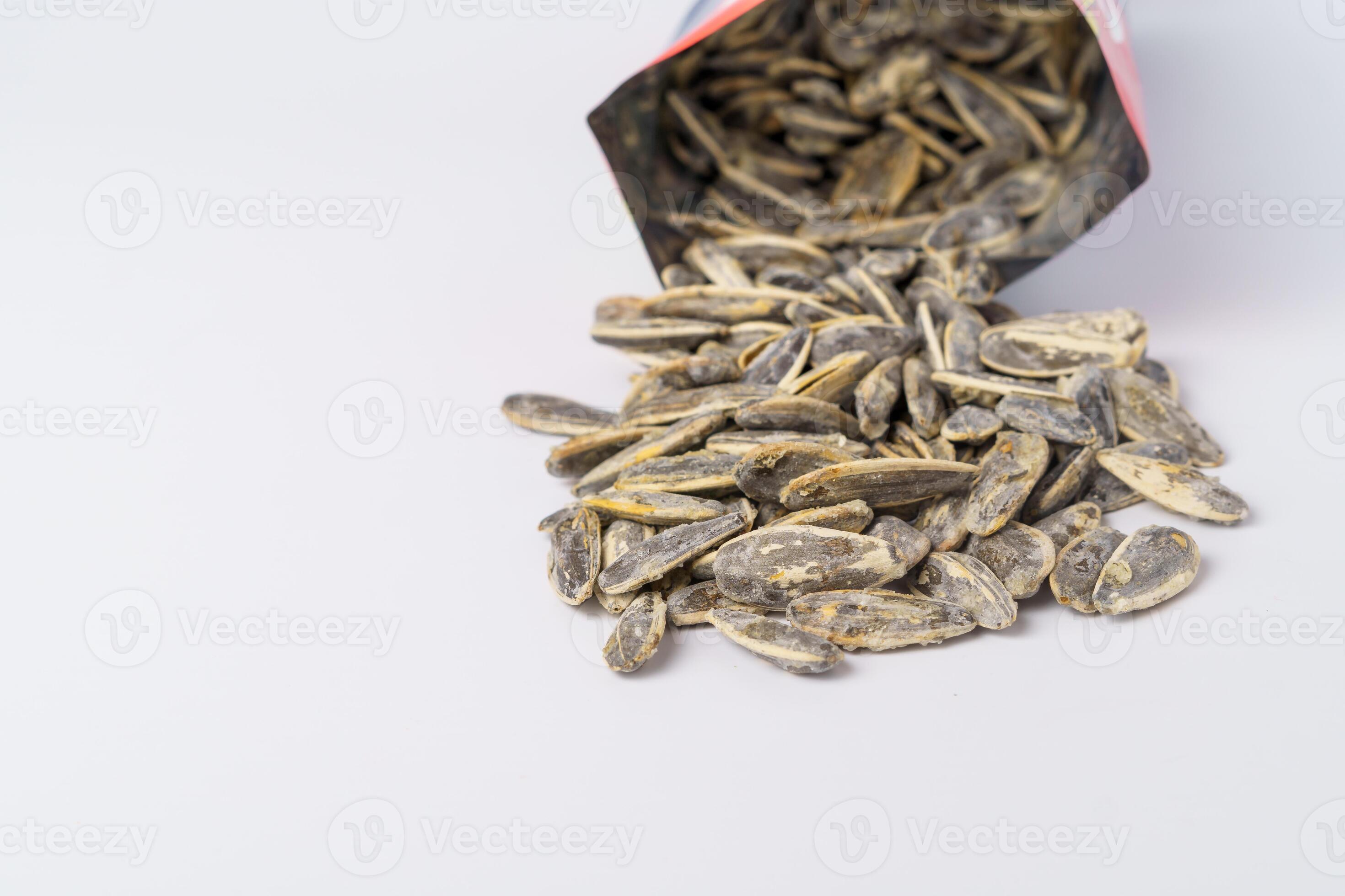 roasted sunflower seeds with salt coming out of their bag 15137788 Stock Photo at Vecteezy