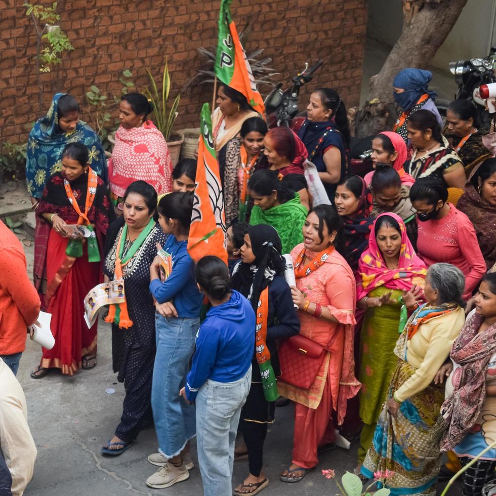 New Delhi, India, November 20 2022 - Bharatiya Janata Party BJP supporters during a rally in support of BJP candidate Pankaj Luthara to file nomination papers ahead of MCD local body Elections 2022 photo