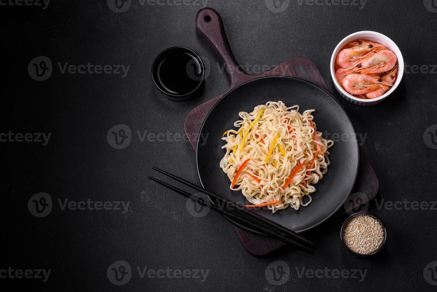 Delicious fresh rice noodles with shrimp, spices and herbs photo