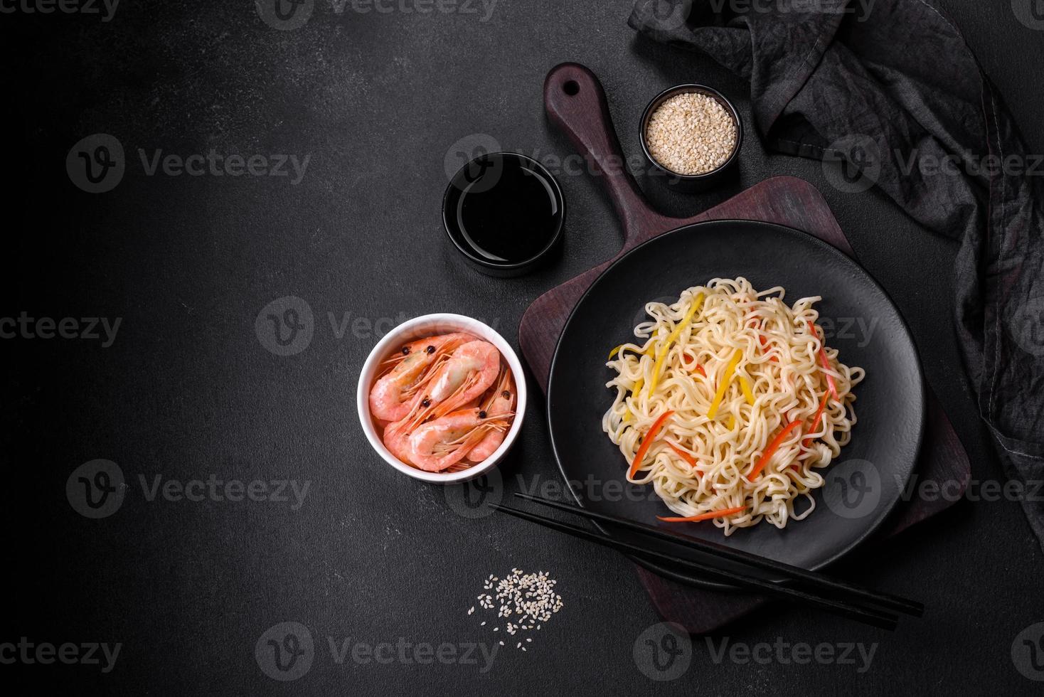 Delicious fresh rice noodles with shrimp, spices and herbs photo