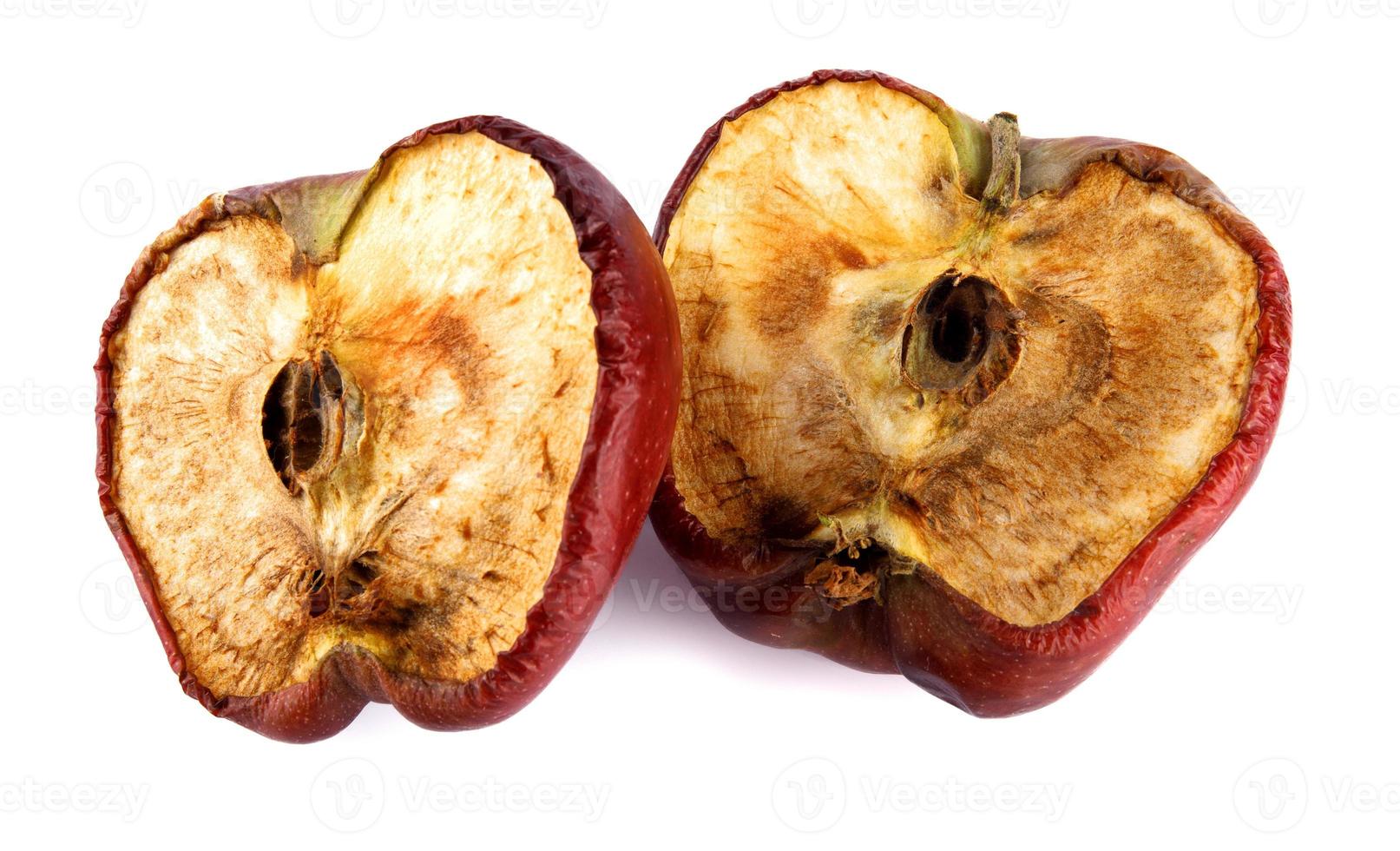 Halved rotten apple is isolated against a white background. Full clipping path. photo