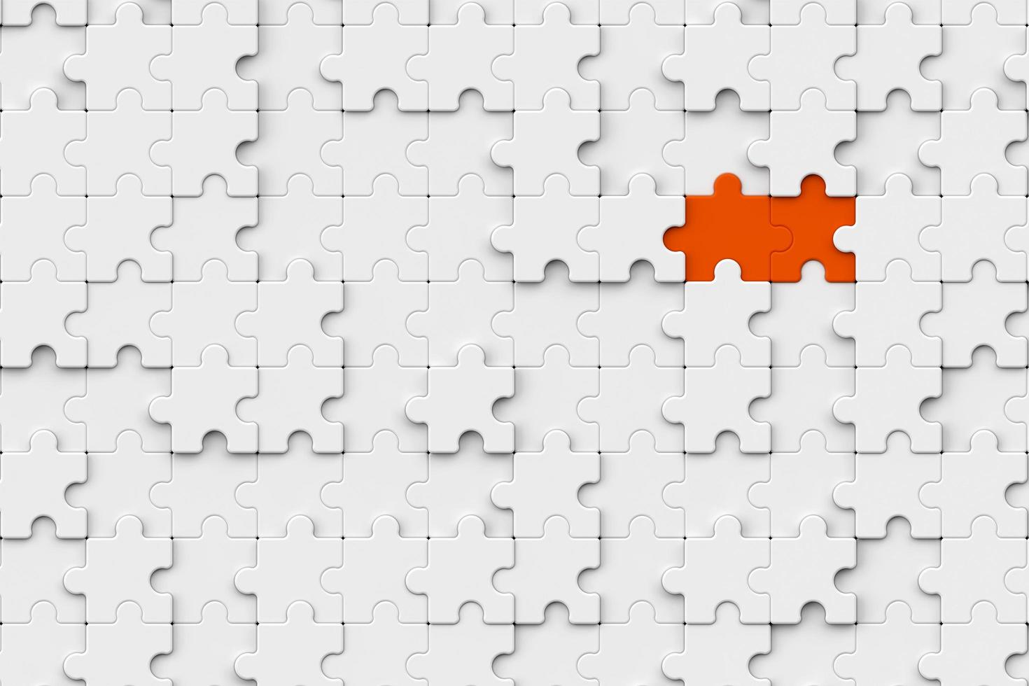 Two orange jigsaw puzzle ready to fit in white jigsaw board. jigsaw puzzle pieces to finished work concept. business success concept photo