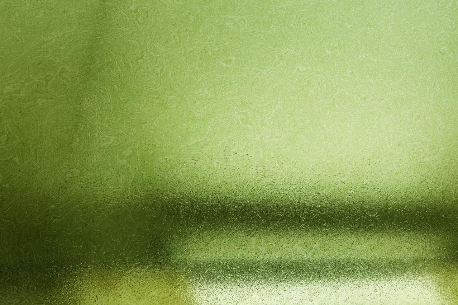 Brushed green metallic wall with scratched surface, abstract texture background photo