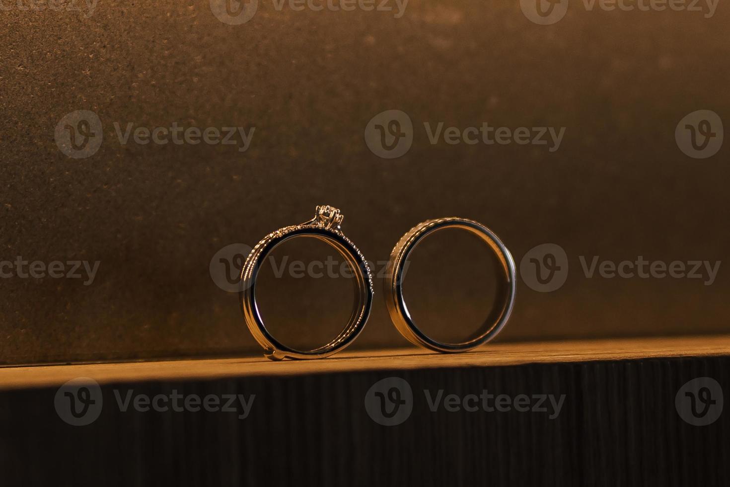 Beautiful couple gold wedding ring detail presentation. photo