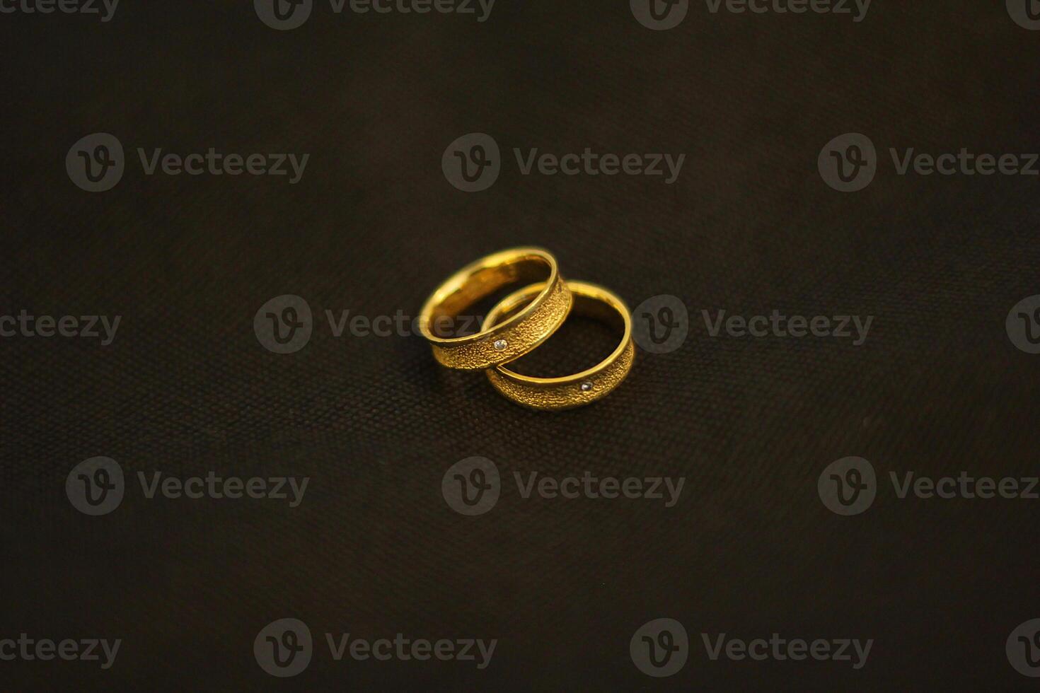 Beautiful couple gold wedding ring detail presentation. photo