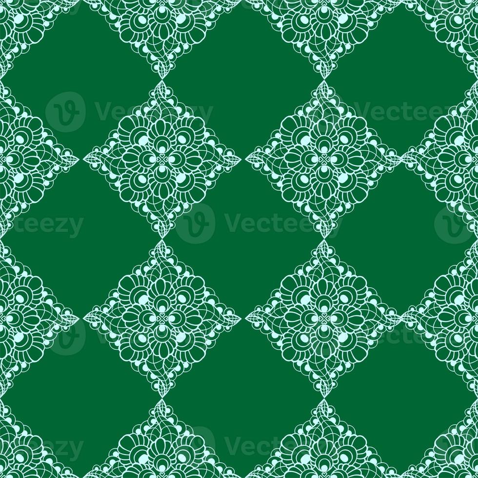 patrón gráfico impecable, azulejo de adorno floral blanco sobre fondo verde, textura, diseño foto
