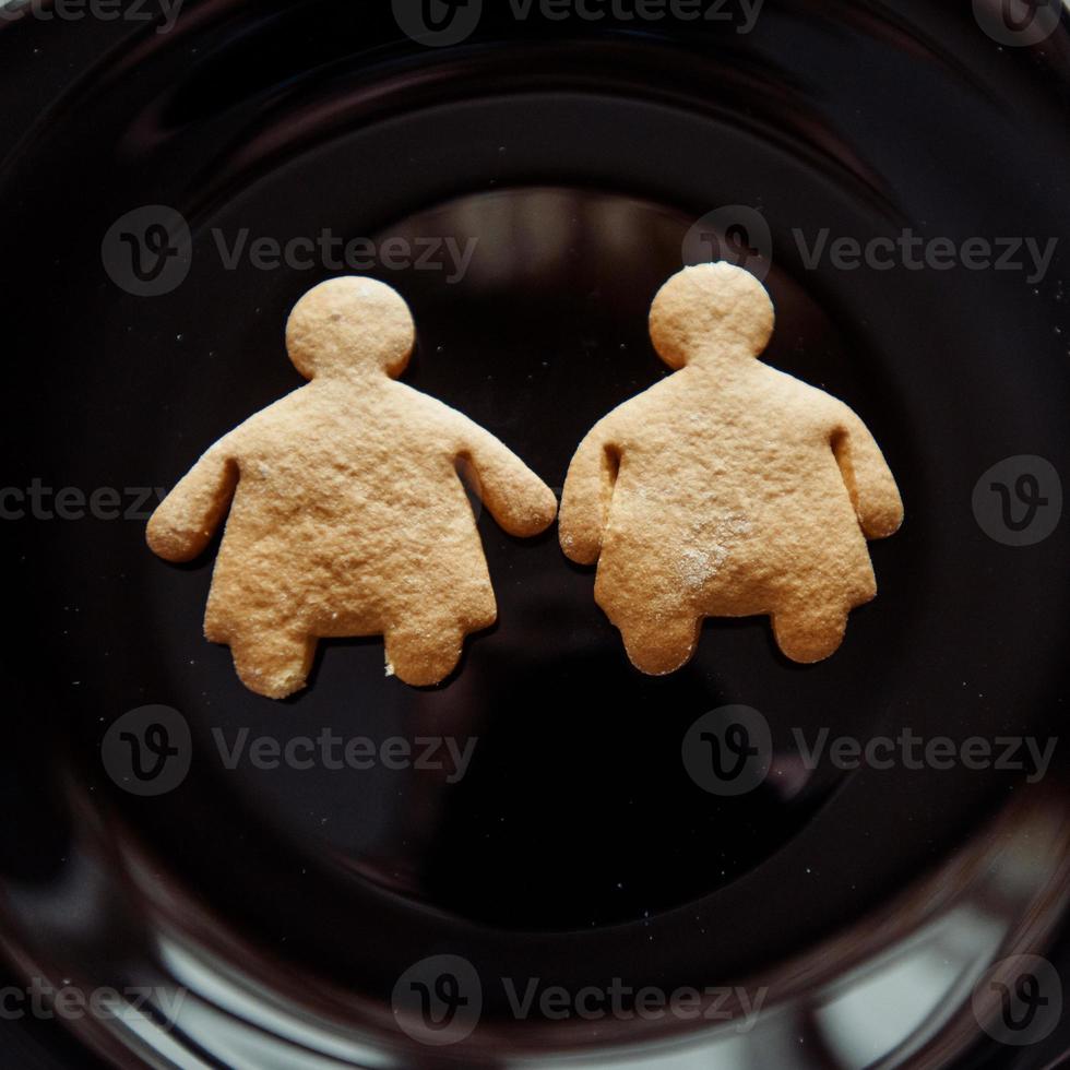 Pile of cookies on a black plate photo