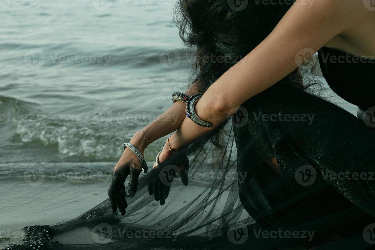 Lady in sitting nearby ocean scenic photography photo