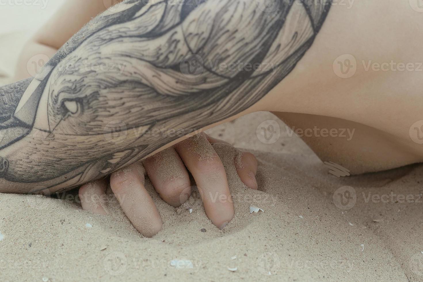 Close up fingers in sand concept photo