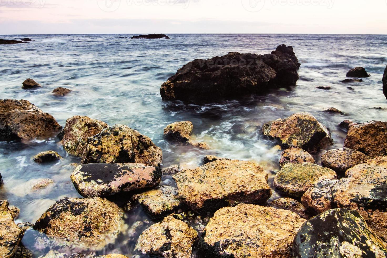 Rocks by the ocean photo