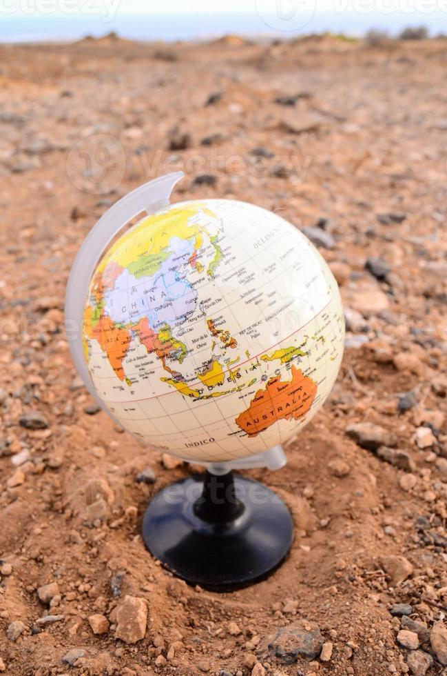 Globe on the ground photo