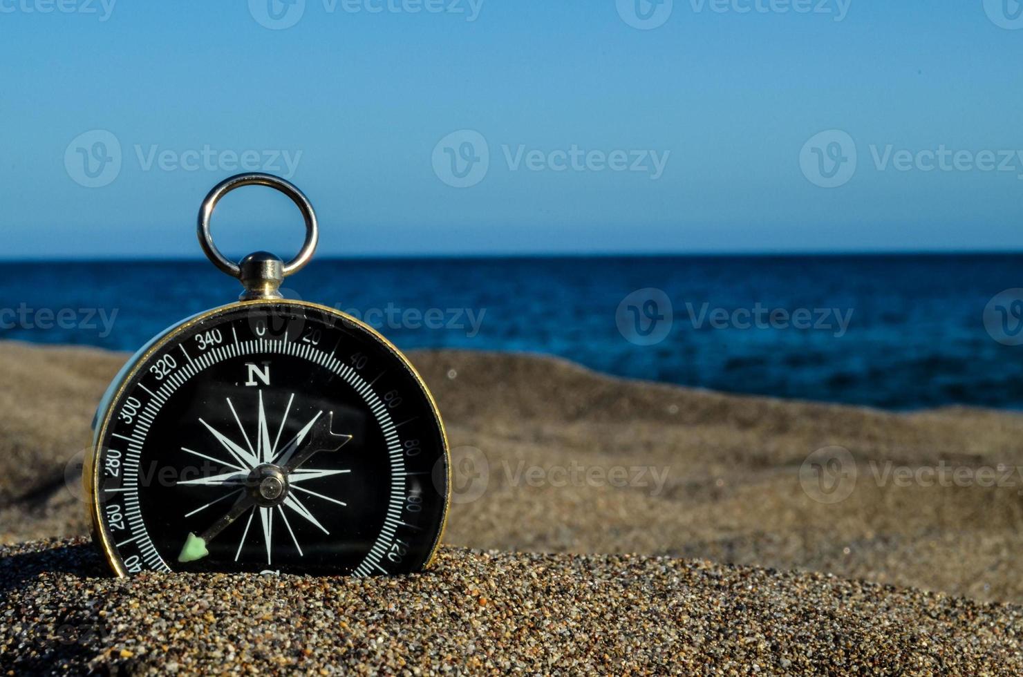 Compass on the sand photo