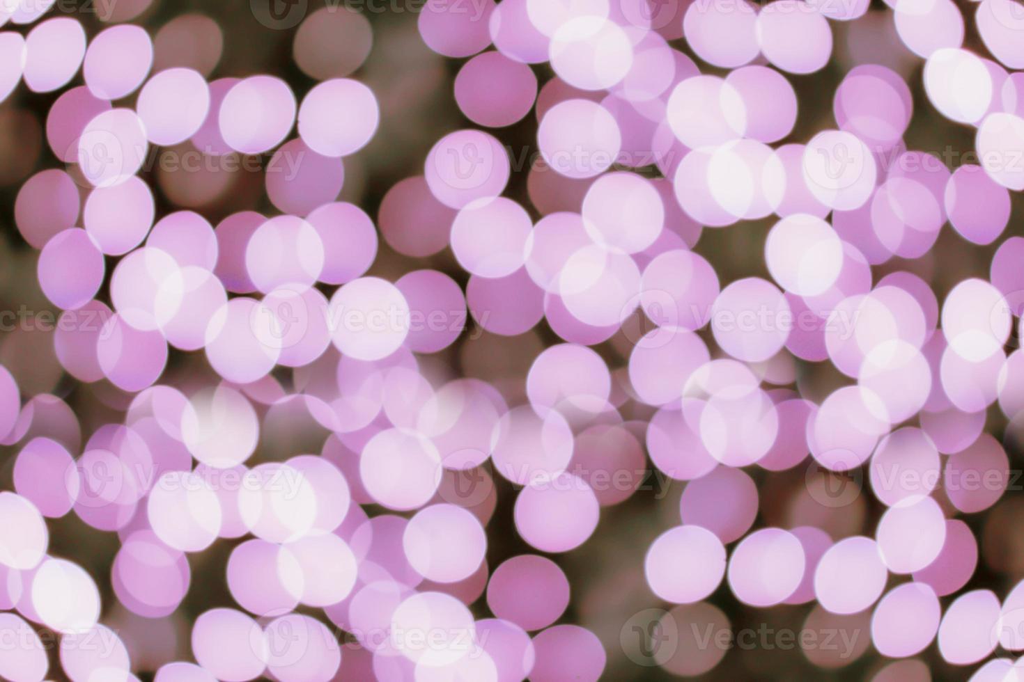 Blurred and bokeh pink led lighting in full screen background. photo