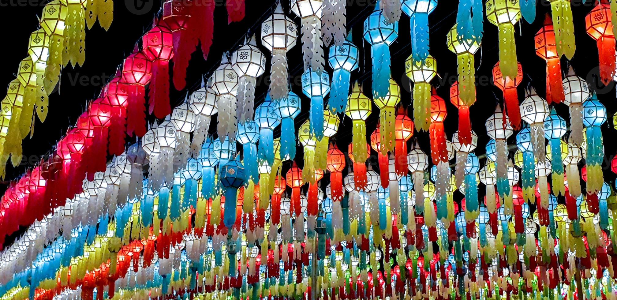 Colorful panorama and perspective view of Thai Lanna style lanterns to hang in front of the temple on night time in Loy Kratong Festival. photo