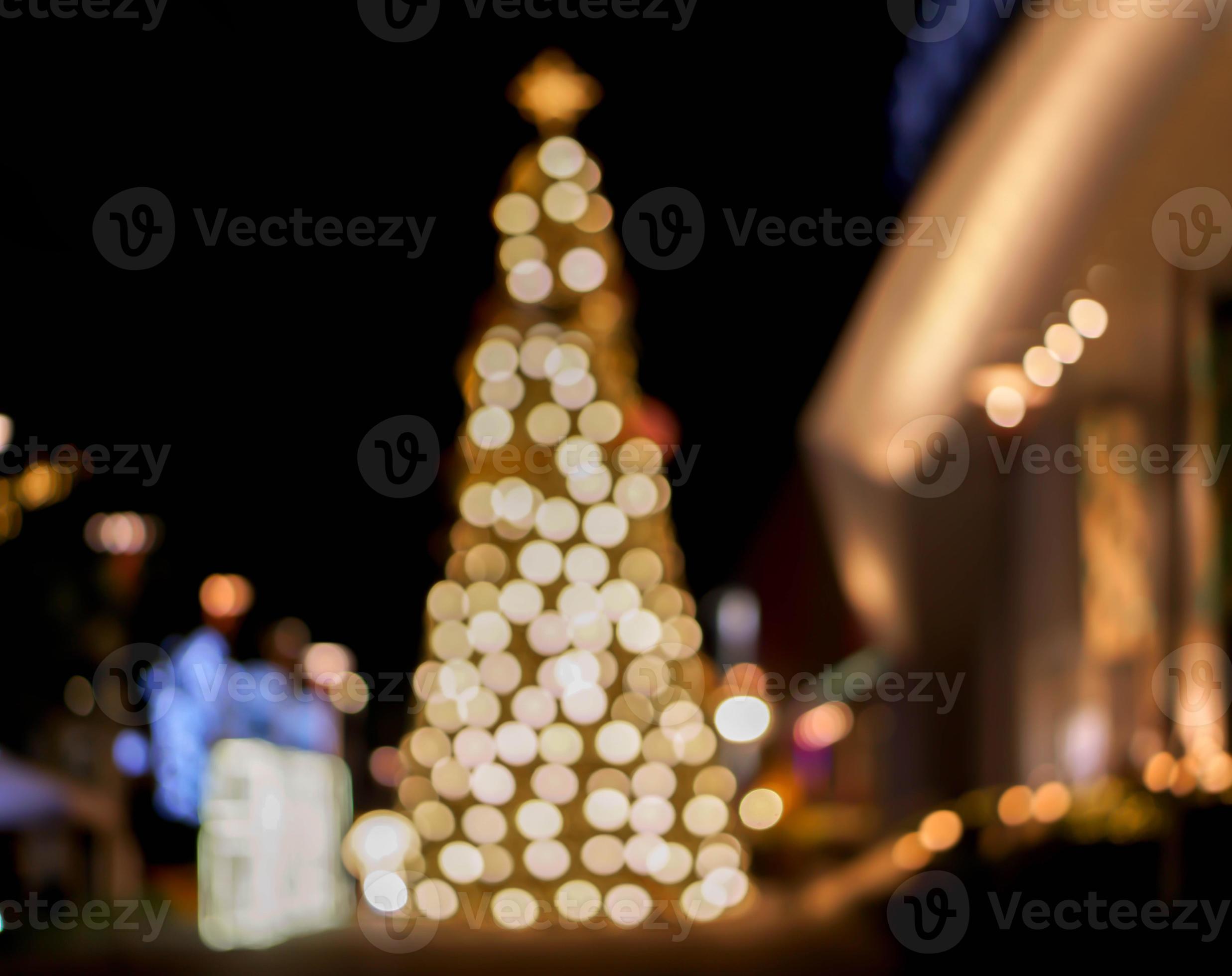 Blurred and bokeh view of Christmas tree and decorate led lighting