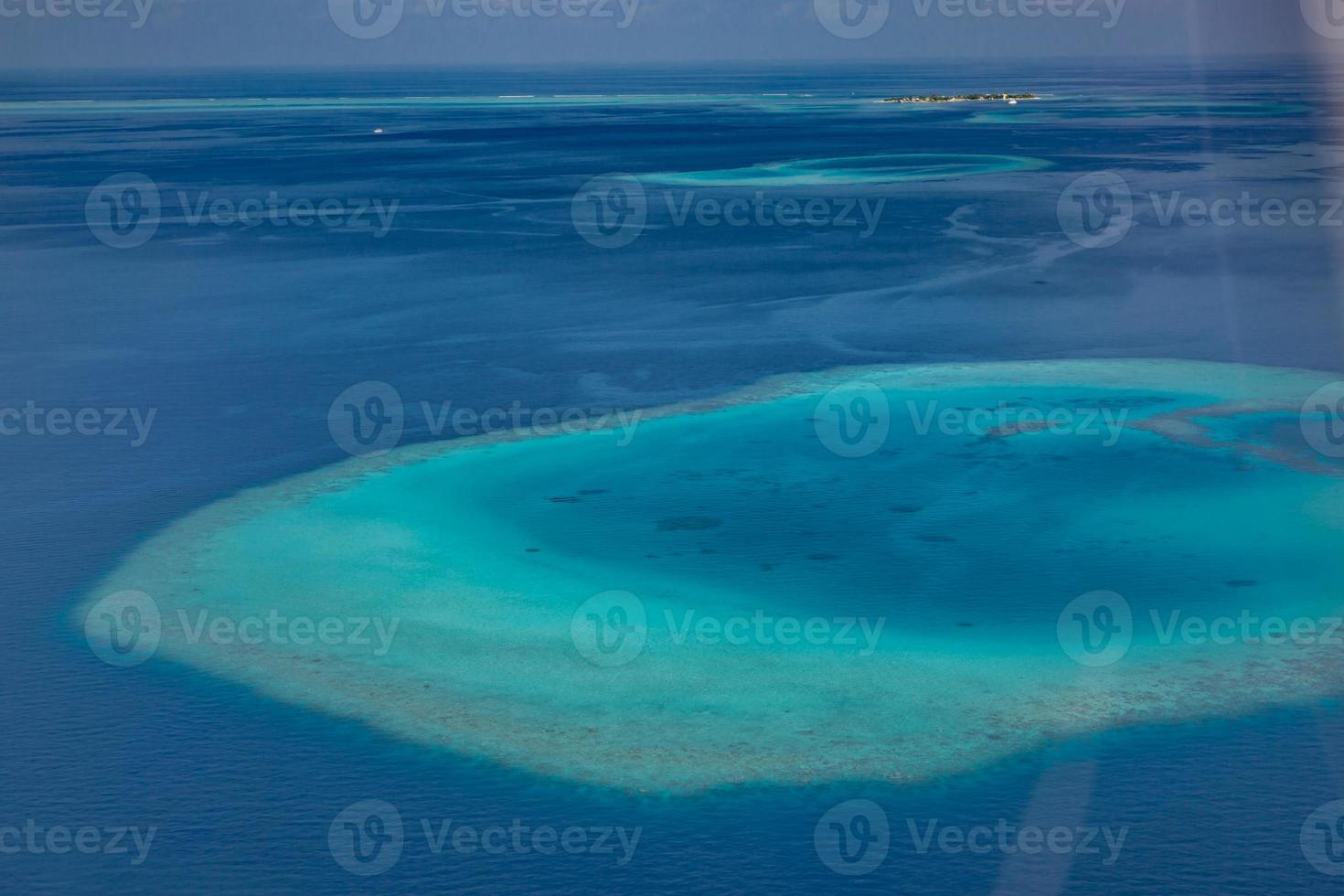 Maldives aerial panorama blue water reef, tropical nature view. Exotic travel destination photo