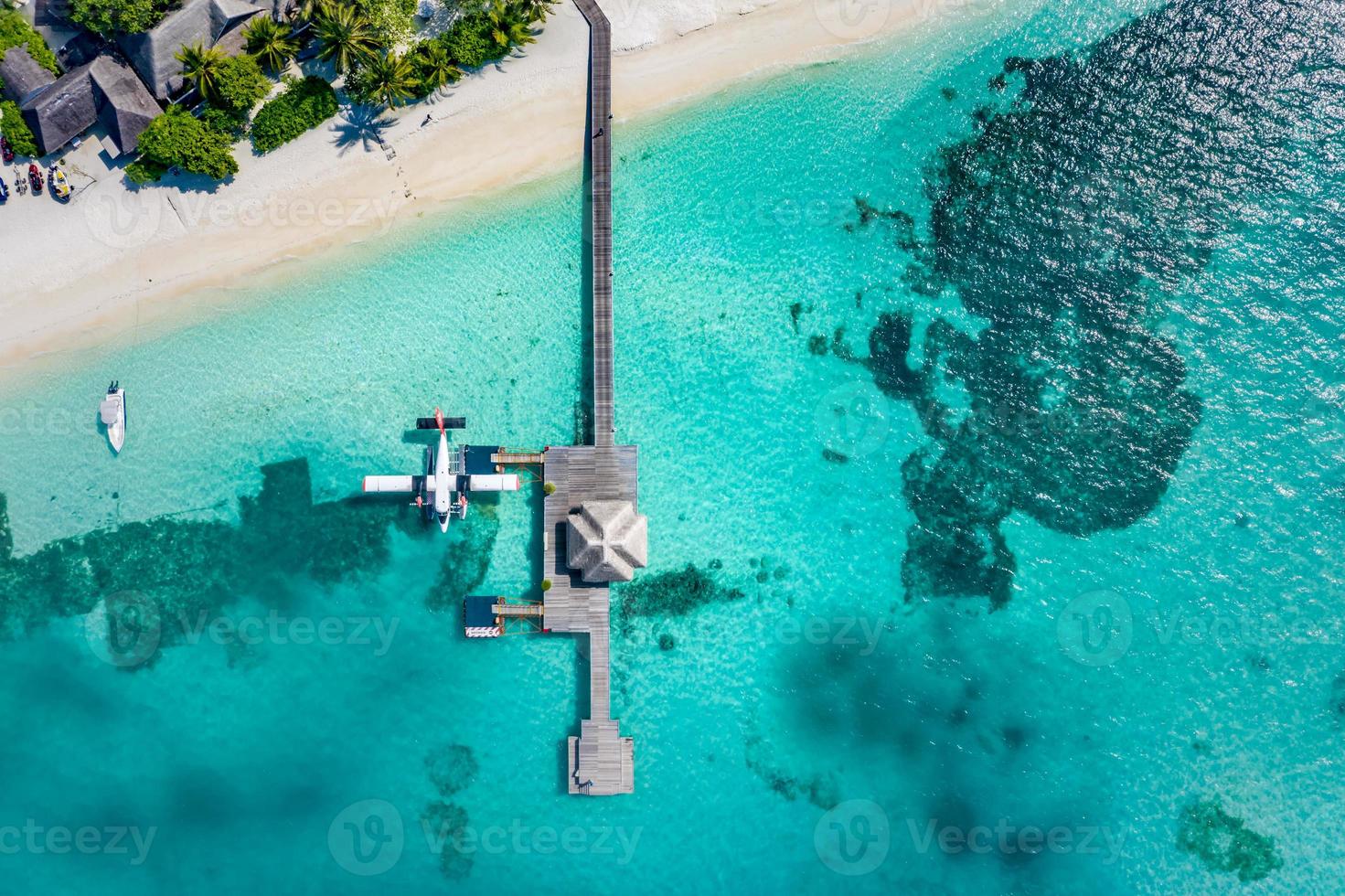 Aerial photo of beautiful paradise Maldives tropical beach on island. Summer holiday, travel vacation concept. Luxury resort, wonderful aerial landscape, amazing beach palm trees and blue sea top view