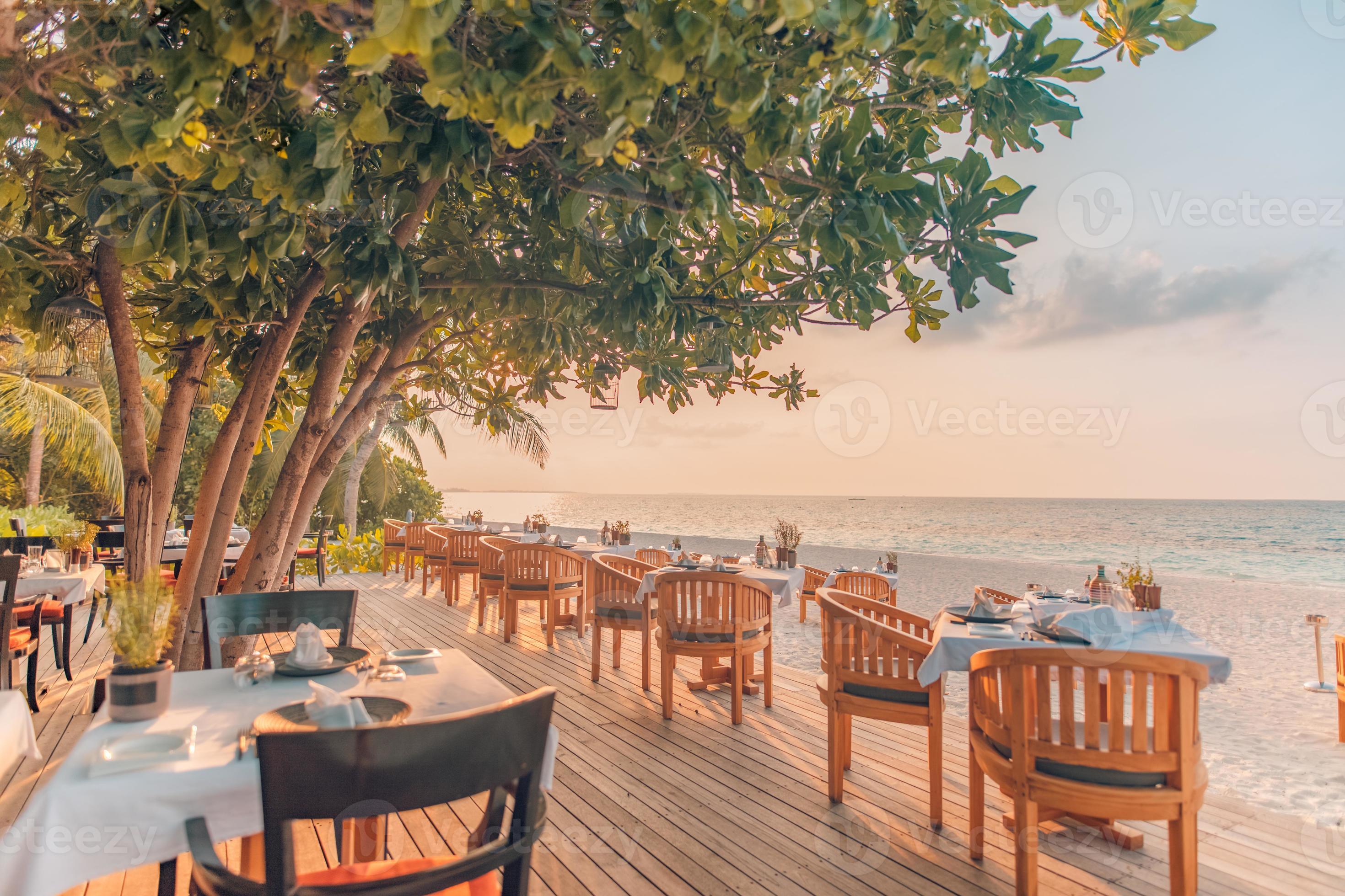 Beach restaurant, beach bar in sunset time. tropical island cafe