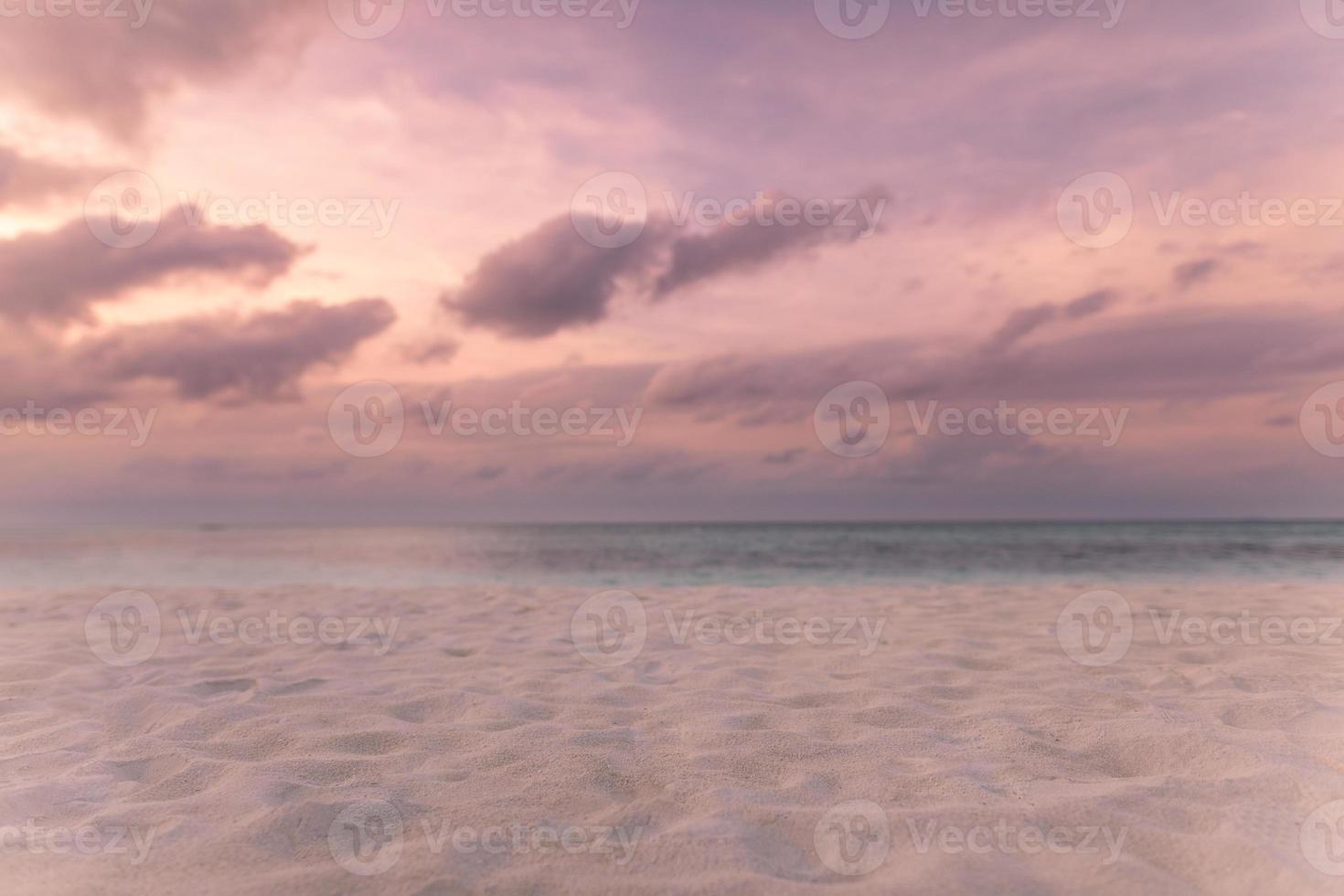 Calm beach, soft sand near the sea, sunset or sunrise sky with clouds. Calmness and tranquility nature concept, inspirational beach background photo