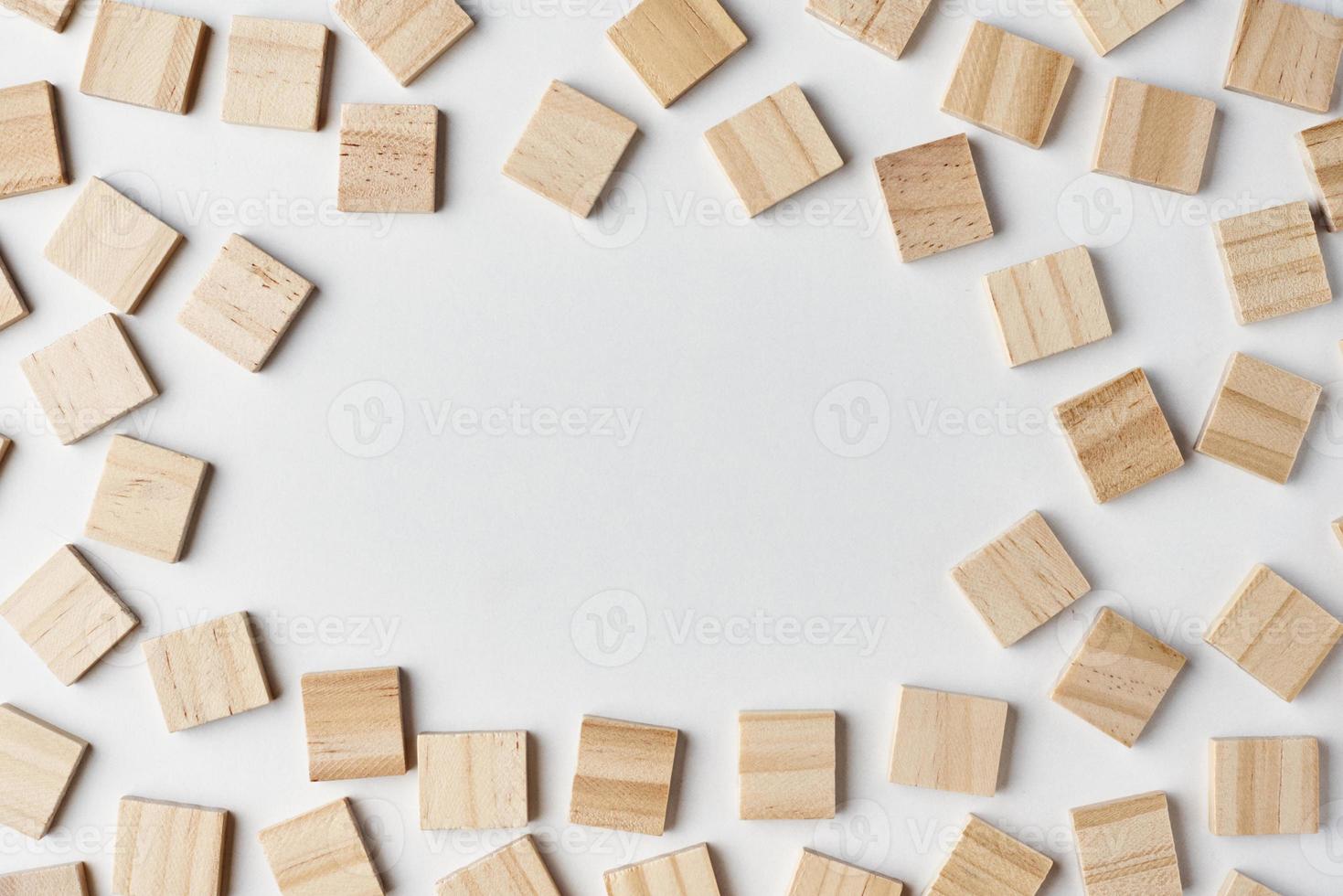 Empty wooden blocks pattern on the white background with copy space, top view photo