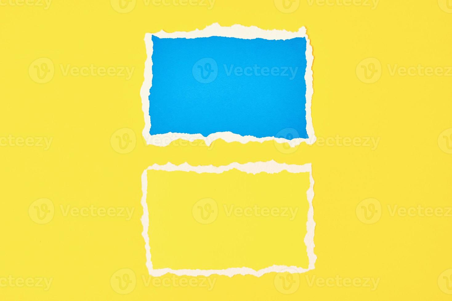 Two ripped paper torn edge sheets on a yellow background. photo