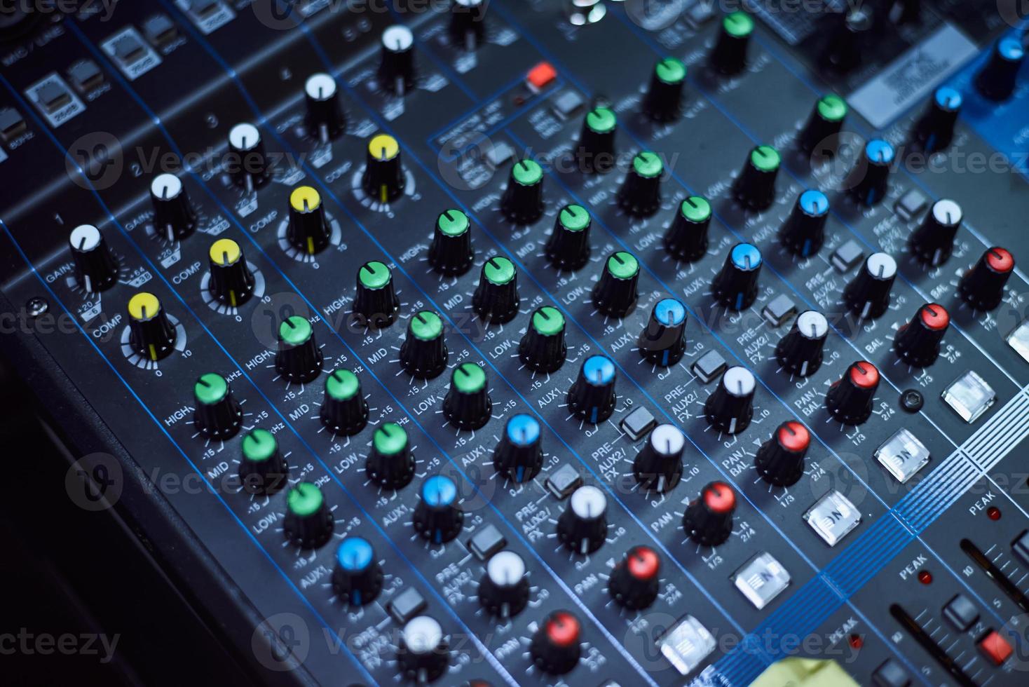 Audio music mixer console on a black background. Sound studio mixing desk photo