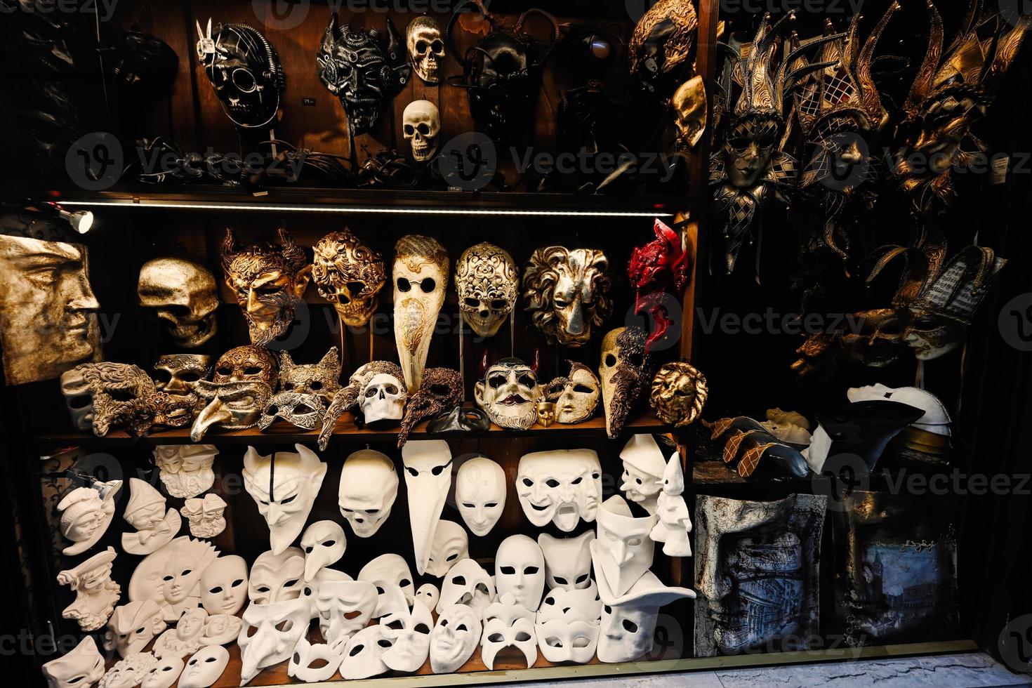 Venetian masks in store display in Venice, Italy. photo