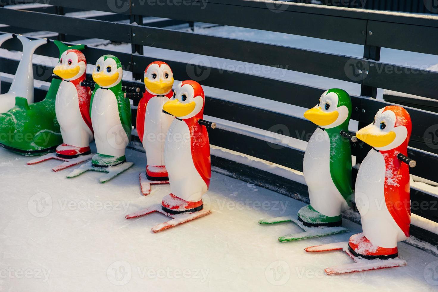 Shot of colorful figures in shape of penguins, needed for skating on ice rink, help people to keep balance and not fall down and being injured photo
