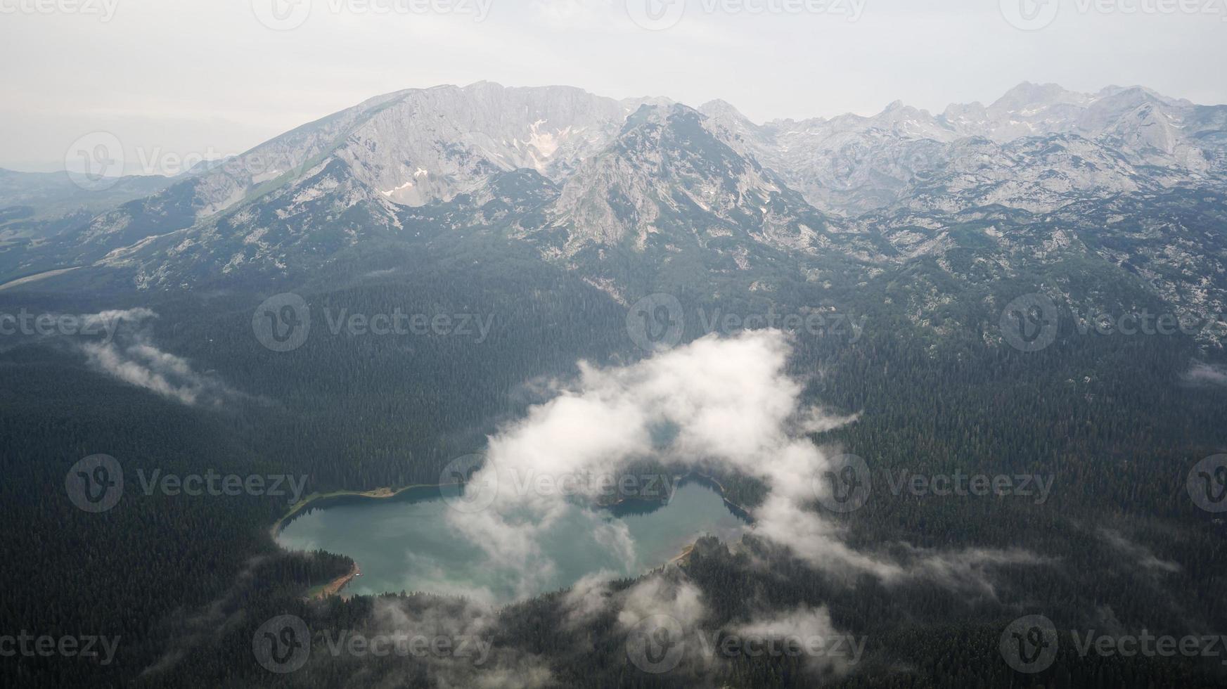 Aerial drone view of Black Lake in National Park Durmitor in Montenegro. Unesco protected area. Holidays  and vacations in nature. Forest around the lake. photo