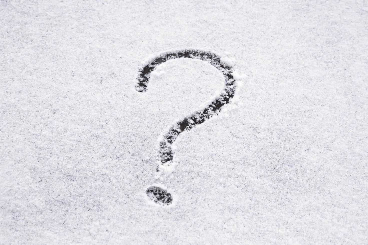 Question mark written on the snow photo
