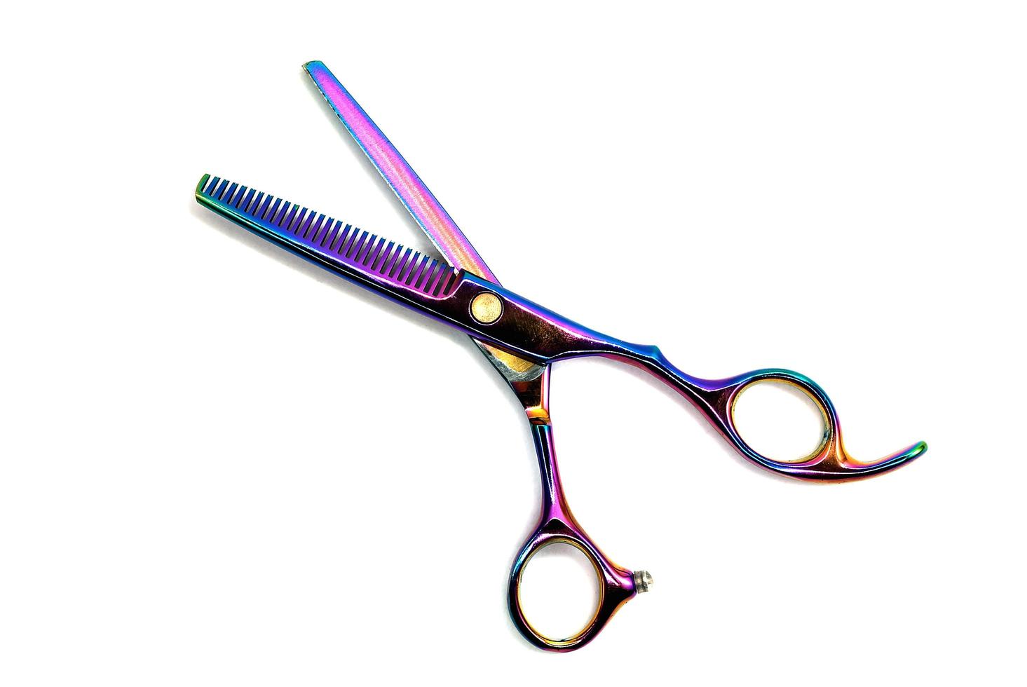 Rainbow color barber scissors isolated on white backgroud photo