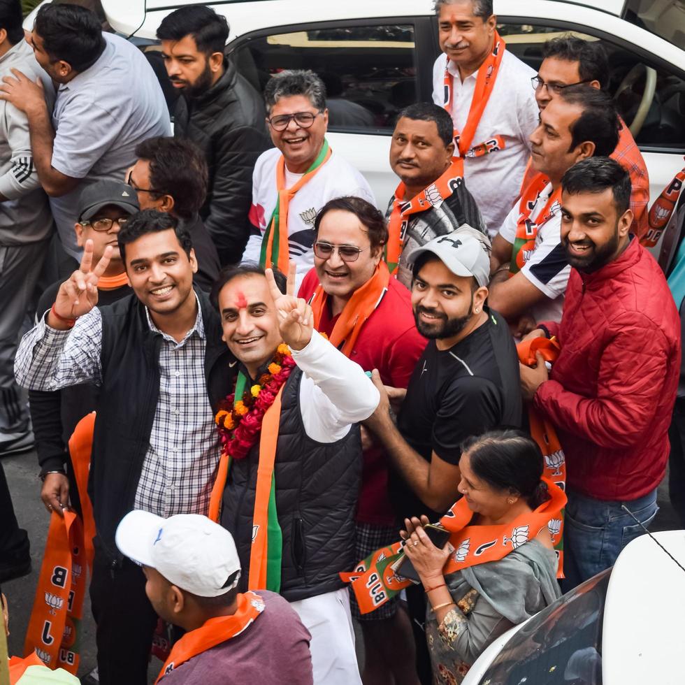 New Delhi, India, November 20 2022 - Bharatiya Janata Party BJP supporters during a rally in support of BJP candidate Pankaj Luthara to file nomination papers ahead of MCD local body Elections 2022 photo