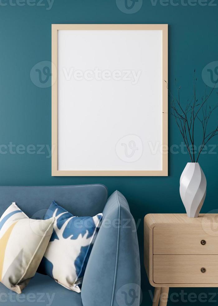 Empty vertical picture frame on blue wall in modern living room. Mock up interior in minimalist style. Free space for picture. Blue sofa and wooden sideboard with vase. 3D rendering. Vertical view. photo