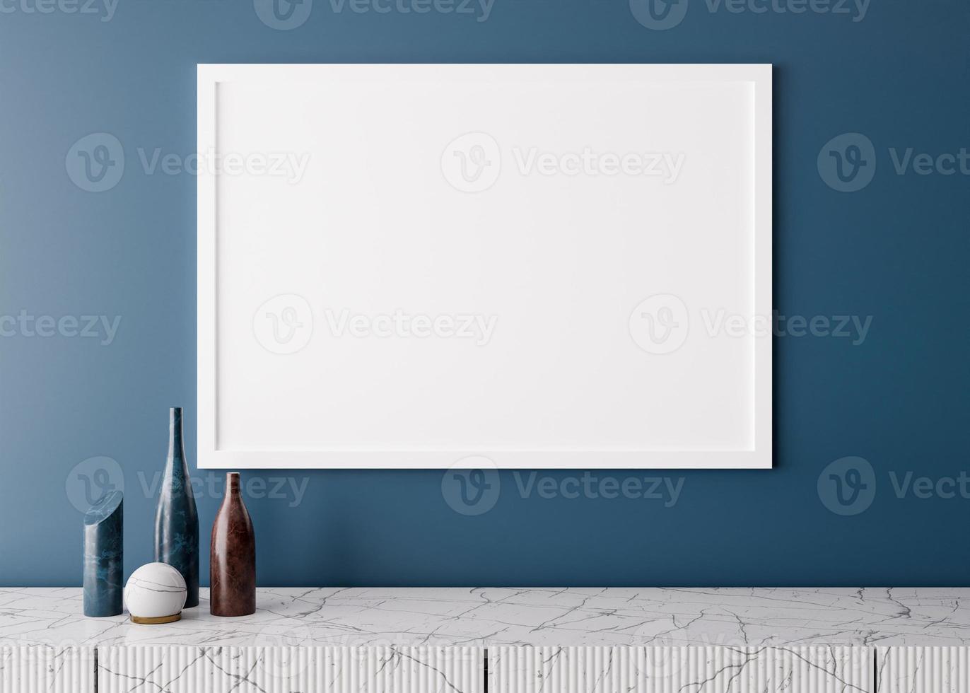 Empty white picture frame on blue wall in modern living room. Mock up interior in minimalist style. Free space, copy space for your picture. Marble console and vases. 3D rendering. Close up view. photo