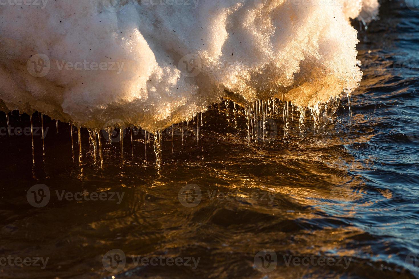 Baltic Sea Coast With Pebbles And Ice at Sunset photo