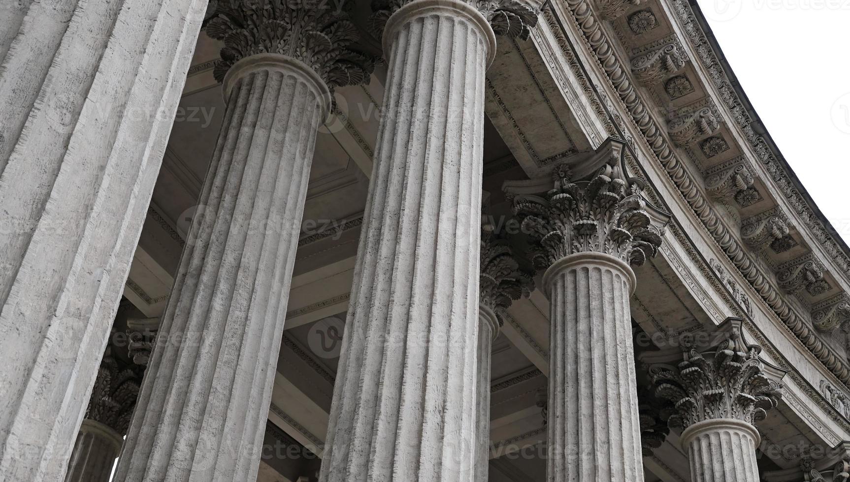 Classic architectural column. Details of the architecture of a historical building. Element of exterior building with columns and Stucco molding on the ceiling of Cathedral in St. Petersburg, Russia. photo