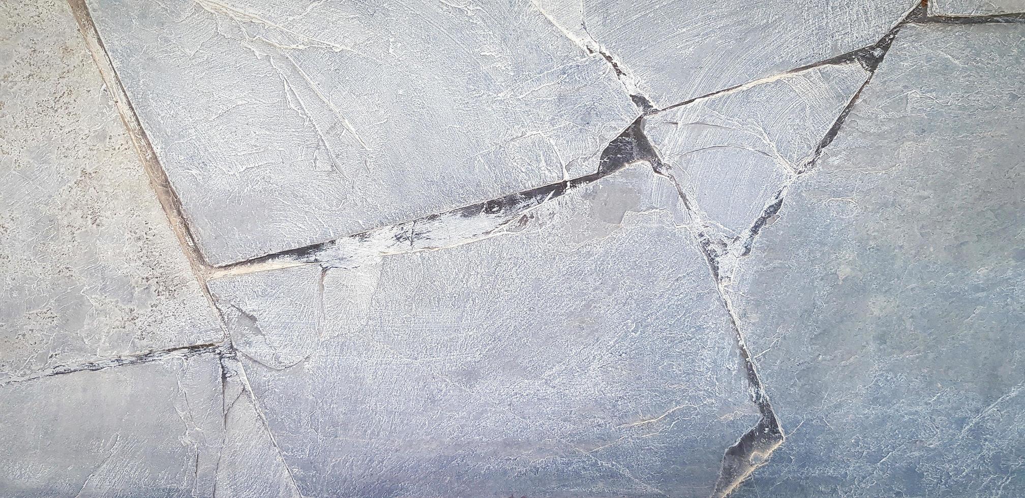 fondo de hormigón gris. pared de cemento agrietado gris o papel tapiz de mármol en tono vintage. patrón de línea en el suelo de granito. foto