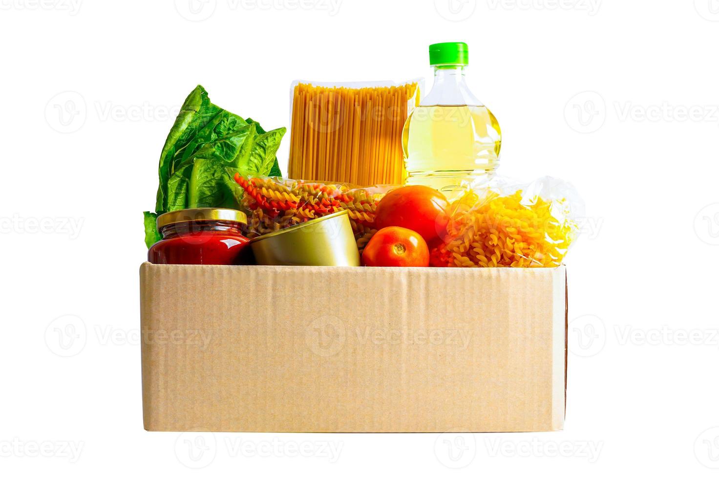Foodstuffs in donation box isolated on white background with clipping path for volunteer to help people. photo
