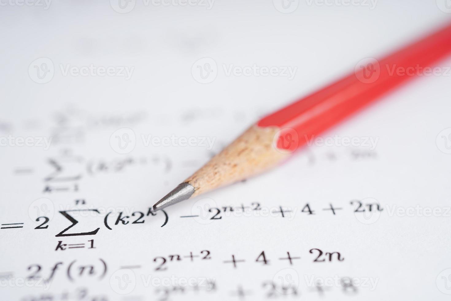 Pencil on mathematic formula exercise test paper in education school. photo