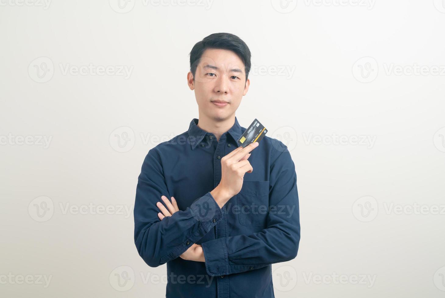 young Asian man holding credit card photo